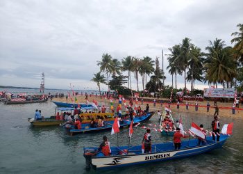 Kemeriahan Konvoi Laut Warnai Pembentangan Bendera 78 meter di Pulau Yerussel