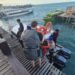 Personel Tourist Police Ditpolairud Polda Papua Barat Daya Berikan Rasa Aman dan Nyaman bagi Wisatawan di Dermaga